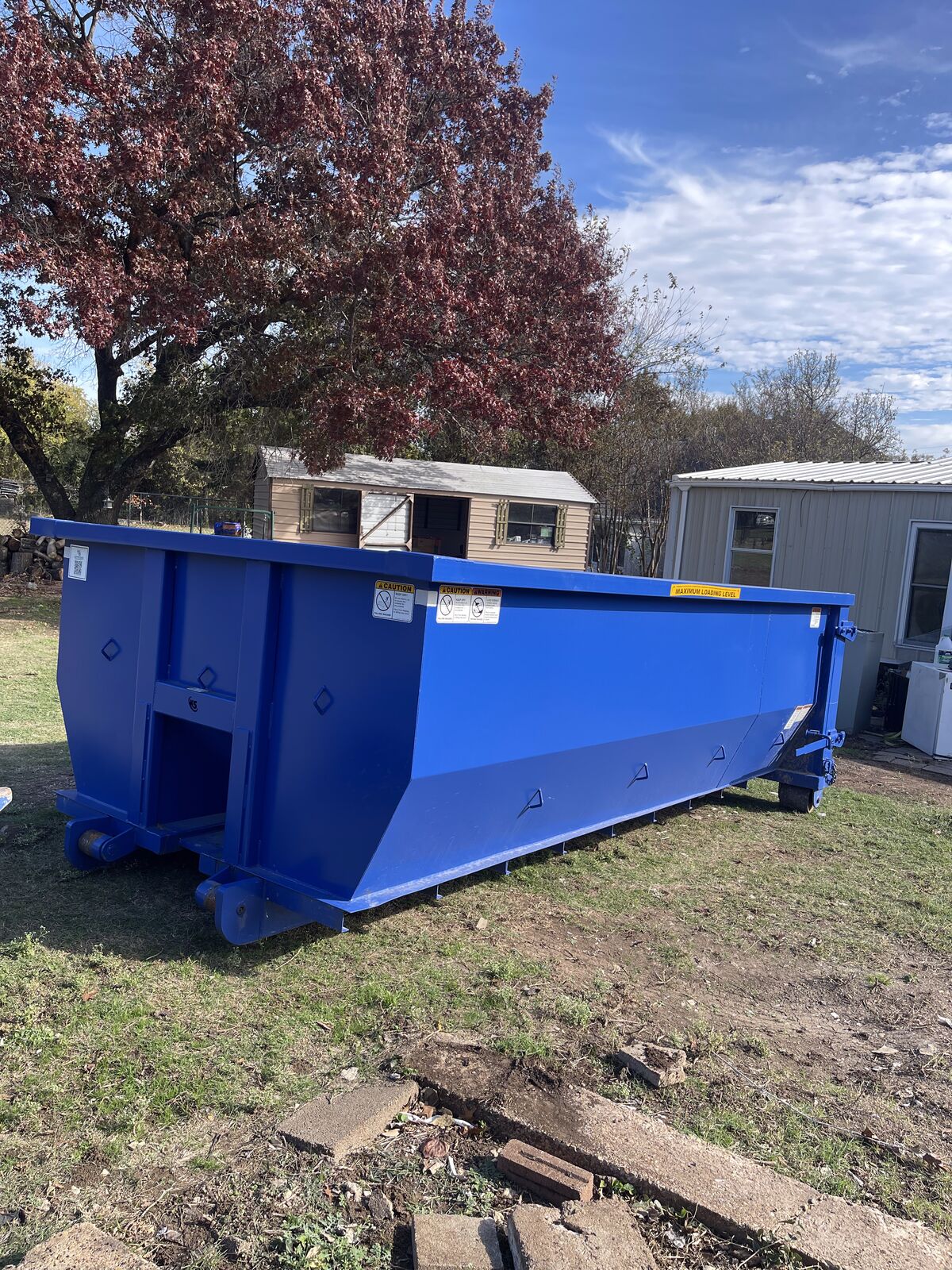 20 yard roll off dumpster rental in a residential driveway